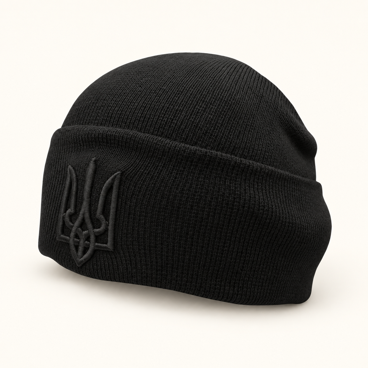 Black SVIY Ukrainian Trident beanie on warm off-white background with soft shadow